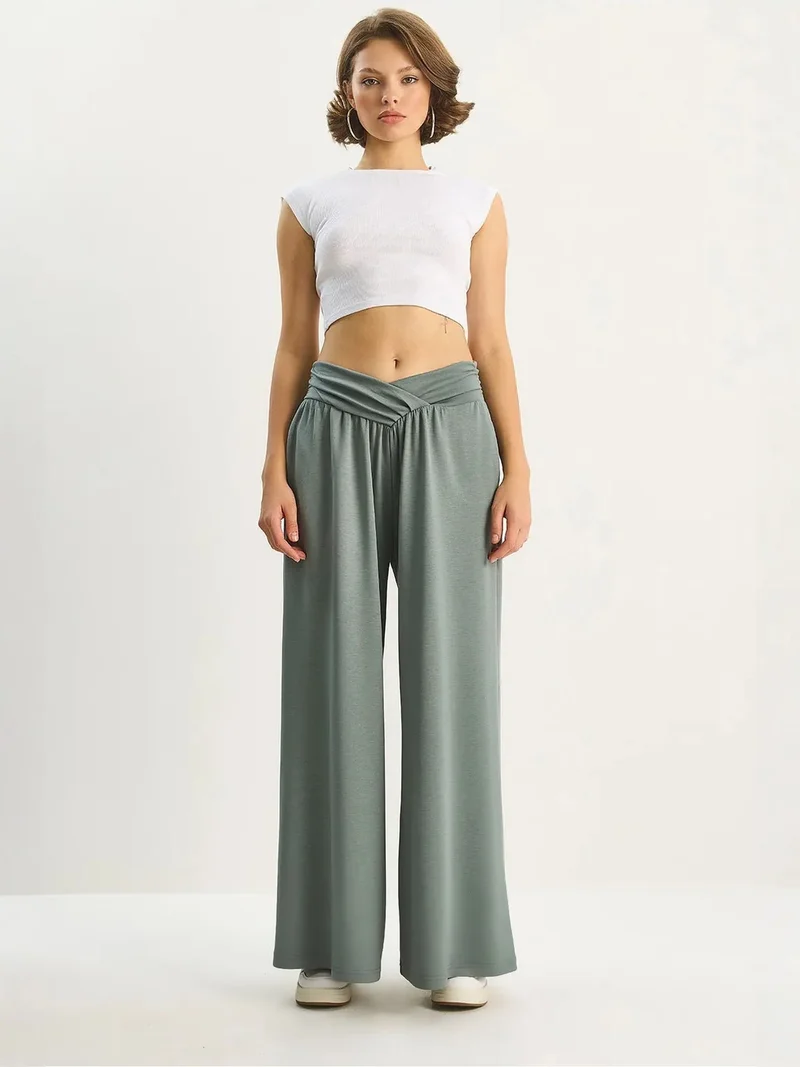 LUCCI Arched Waist Palazzo Pants